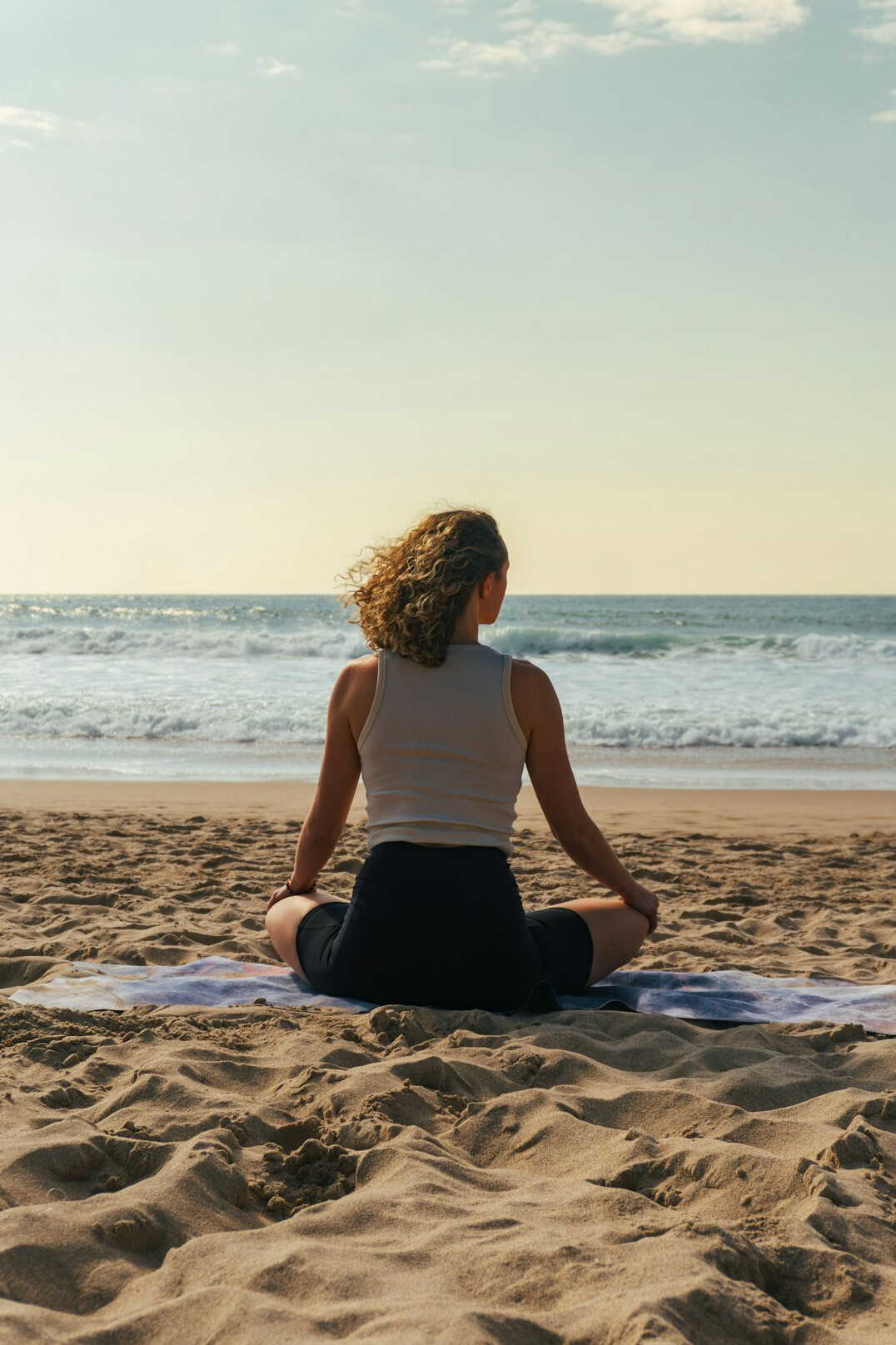 person meditating outdoors