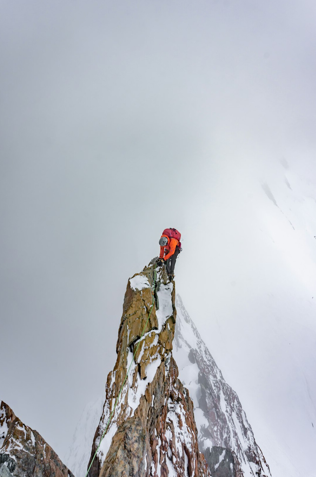person climbing mountain